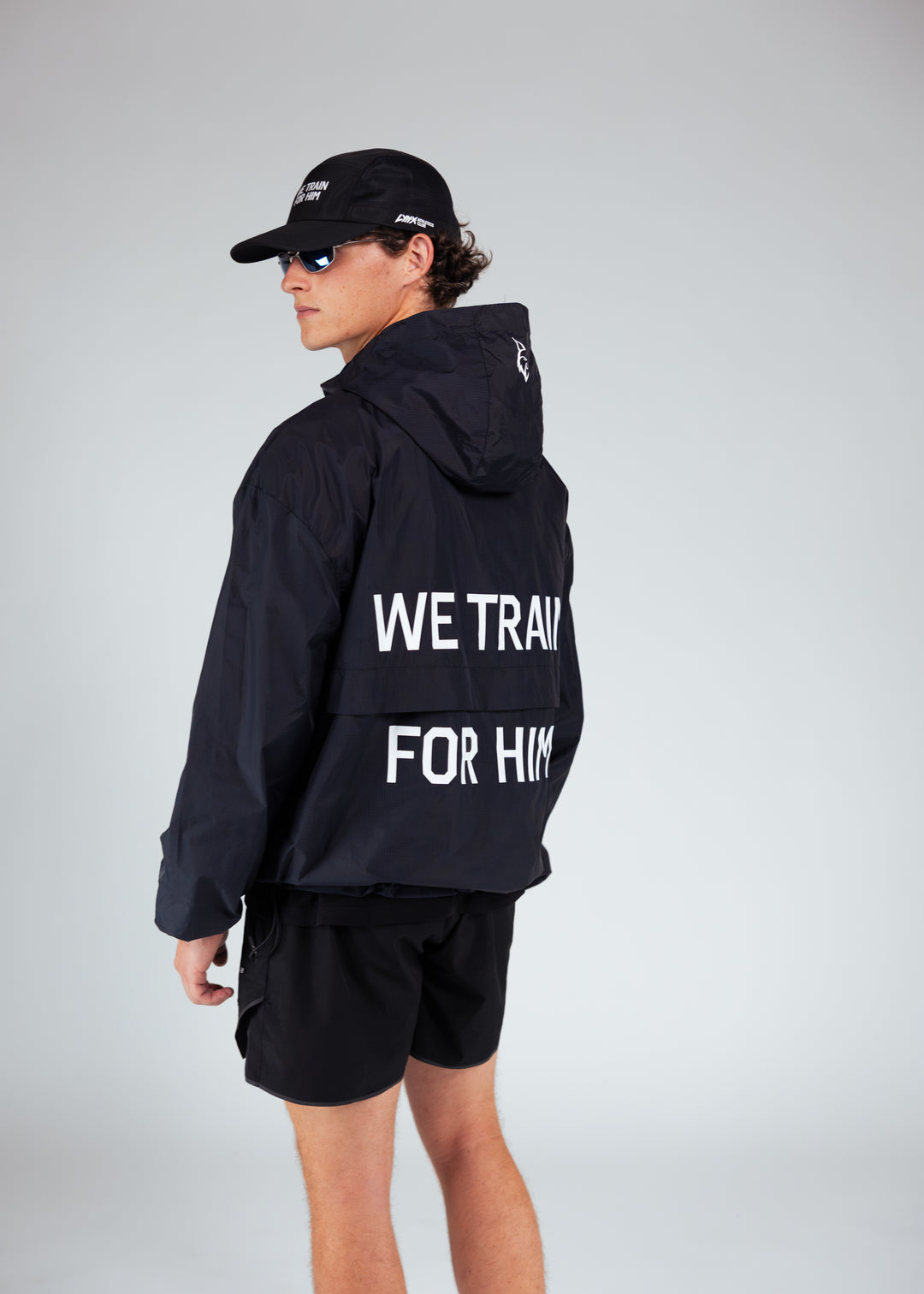 athlete wearing we train for him windbreaker