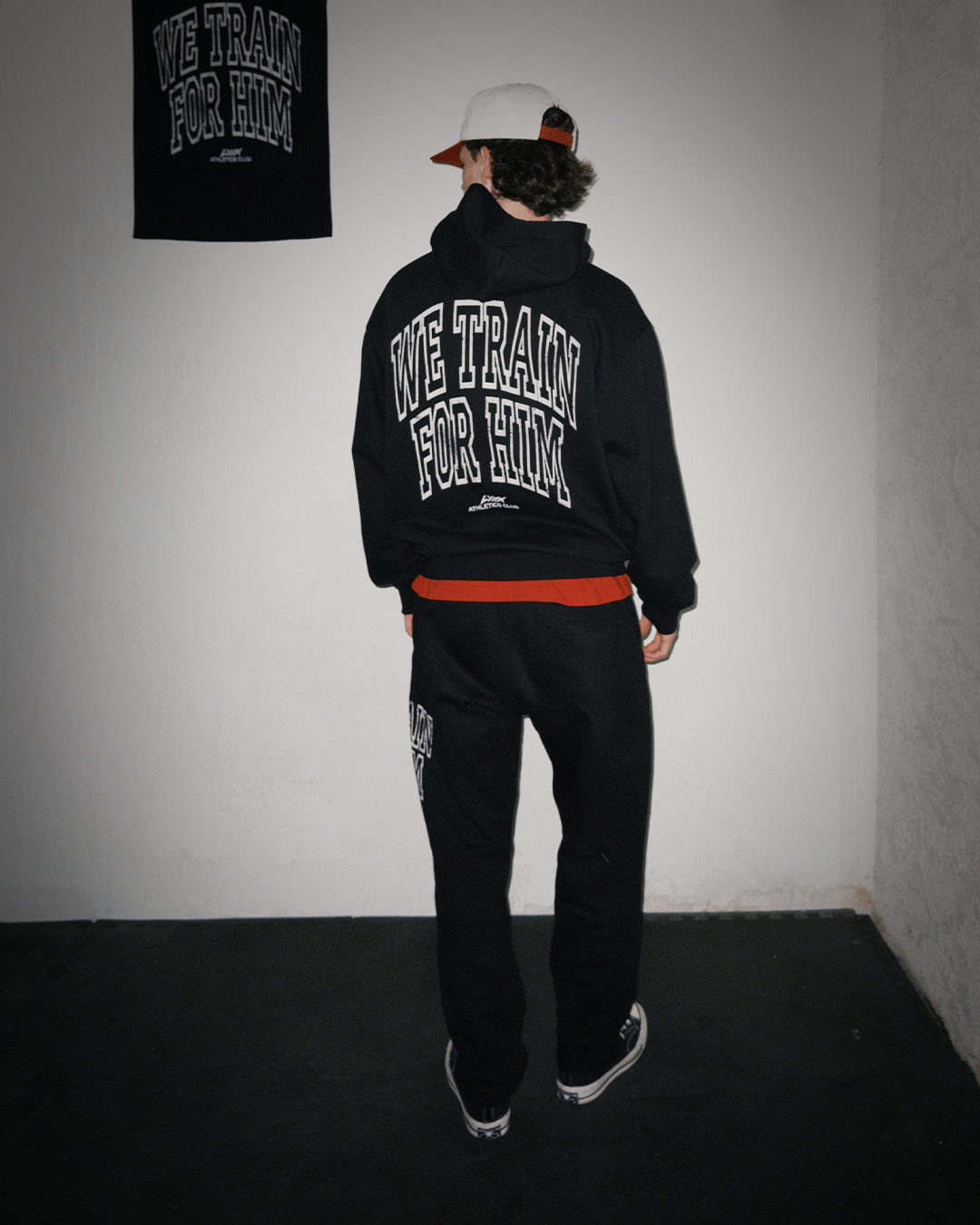 model wearing we train for him hoodie with matching set