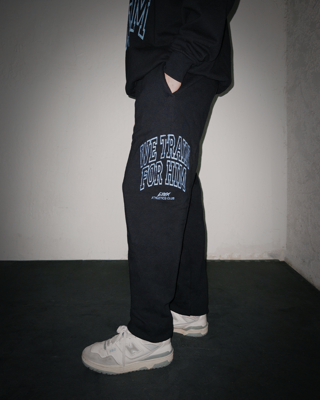 model wearing we train for him sweatpants
