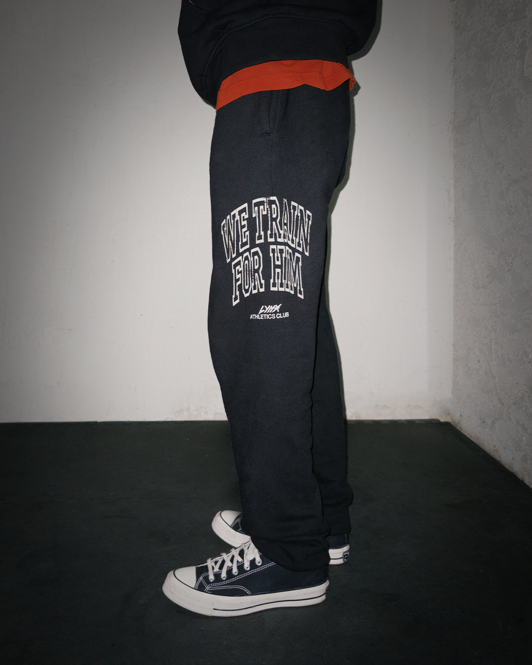 person wearing we train for him sweatpants