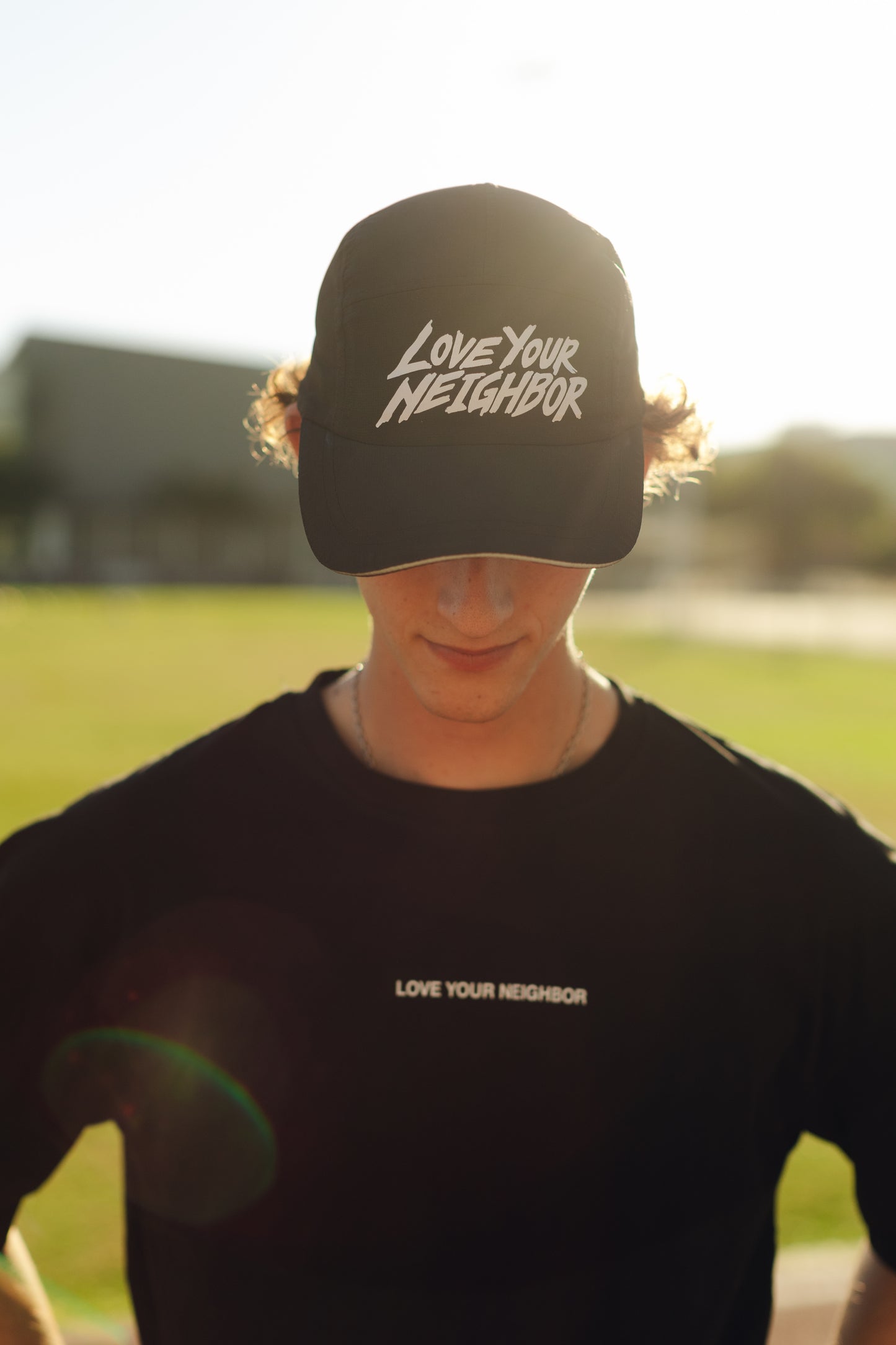 "LOVE YOUR NEIGHBOR" RUN HAT IN BLACK